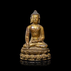 A Tibetan Gilt Copper Alloy Figure of Buddha Shakyamuni, 15th/16th Century  十五/十