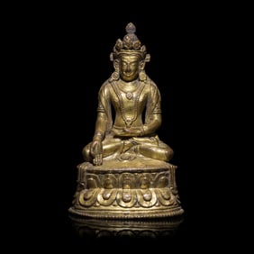 A Tibetan Gilt Copper Alloy Seated Figure of a Crowned Bodhisattva, 16th/17th Century  十