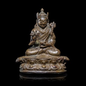 A Tibetan Copper Alloy Seated Figure of Padmasambhava, 16th/17th Century  十六/十