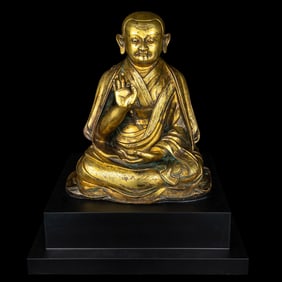 A Large Sino-Tibetan Gilt Bronze Figure of a Lama 巨型銅鎏金上