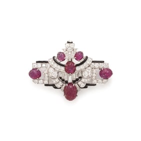 MAUBOUSSIN, ART DECO, CARVED RUBY, DIAMOND, AND BLACK ENAMEL BROOCH
