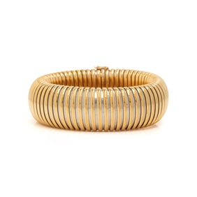 CARTIER, YELLOW GOLD AND STEEL TUBOGAS BRACELET