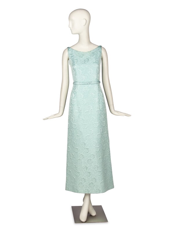 Brocade Dress, Attributed to Christian Dior : Brocade Dress, Attributed to Christian Dior Sleeveless A-line sheath dress in powder blue matelassé fabric. Midi length. Wide neckline. Decorative bow at back neckline. Zipper and hook-and-