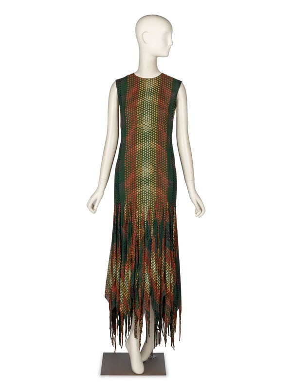 Pierre Cardin, Printed Gown, c.1960's: Pierre Cardin, Printed Gown, c.1960's Sleeveless column gown in green silk chiffon with all-over multicolor circular print. About ankle length. Long triangular flounces applied around hips, exten