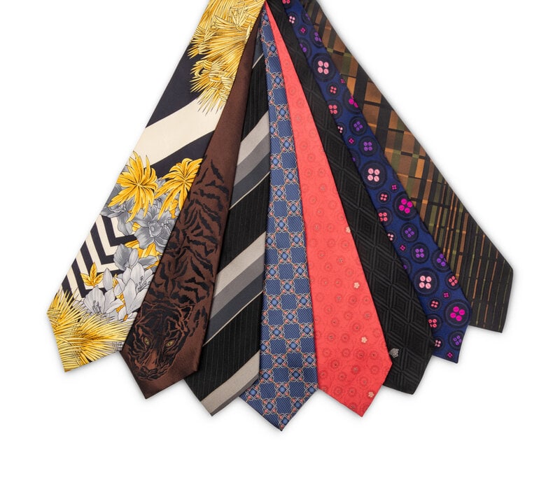 Eight Designer Neckties, Personally Owned & Worn by Mike Ditka: Eight Designer Neckties, Personally Owned & Worn by Mike Ditka Lot comprised of eight designer neckties, including the following brands: Versace (2), Fabergé, Paul Smith (2), Prada, Gior