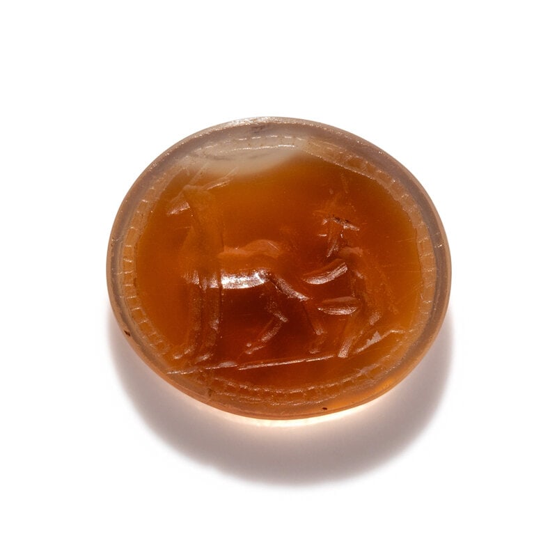 A Roman Carnelian Ring Stone with a Goatherder Milking a Goat (1 of 3)