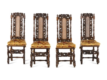 A Set of Four William and Mary Style Carved Oak Dining Chairs