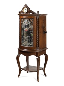 A Regina Corona 15 1/2 Inch Disk Change Music Box with Clock