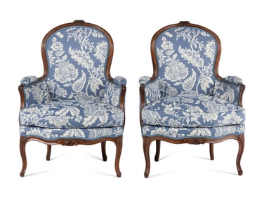 A Pair of Louis XV Walnut Bergères