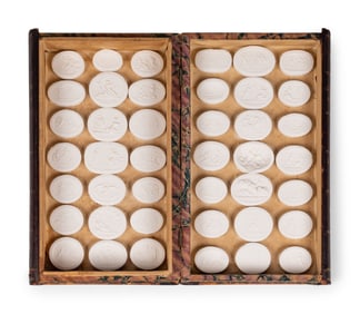 A Collection of Grand Tour Plaster Intaglios in Book-Form Cases