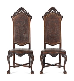 A Pair of Portuguese Carved Walnut and Tooled Leather Hall Chairs