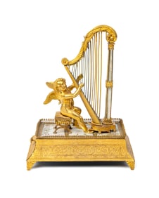 A Palais Royal Gilt Musical Ring Stand