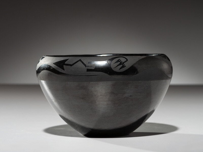 Maria Martinez (San Ildefonso, 1887-1980) Blackware Pottery Bowl, with Avanyu1923-1925: Maria Martinez (San Ildefonso, 1887-1980) Blackware Pottery Bowl, with Avanyu 1923-1925 signed Marie height 4 inches x diameter 6-1/4 inches This lot is located in Cinc
