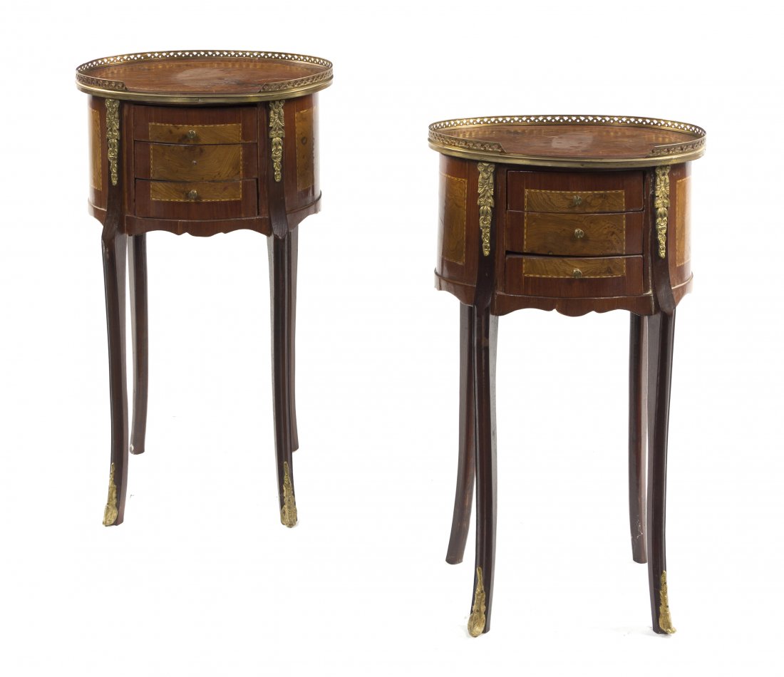 A Pair of Louis XV Style Gilt Metal Mounted Side Ta: A Pair of Louis XV Style Gilt Metal Mounted Side Tables, each having oval three-quarter galleried tops above the conforming cases, fitted with three drawers, raised on cabriole legs ending in sabots. 