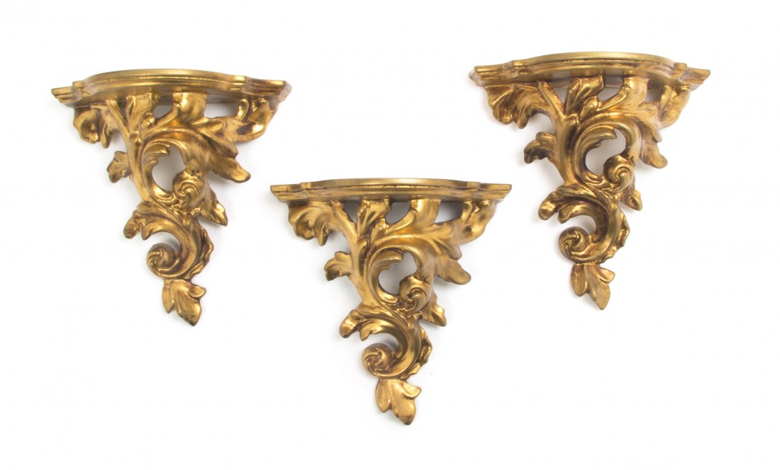 A Set of Three Italian Giltwood Brackets, Height 8: A Set of Three Italian Giltwood Brackets, each with a shaped demilune top over the Rococo open foliate supports. Height 8 1/2 inches. Property from the Collection of Dr. and Mrs. Sumner Barenberg, Chi