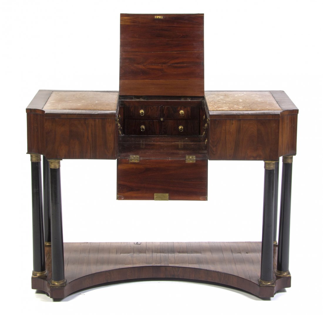A Continental Walnut Veneered Dressing Table, Heig: A Continental Walnut Veneered Dressing Table, the rectangular marble inset top with rounded corners and a central lift panel opening to a fitted interior, raised on a series of six gilt metal mounted 