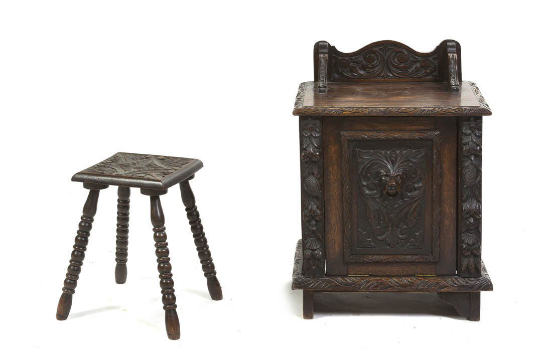 A Renaissance Revival Carved Oak Coal Hod, Height: A Renaissance Revival Carved Oak Coal Hod, having a rectangular part galleried top over the fall front storage bin, centered with lion mask decoration, together with a Renaissance revival stool. Heigh