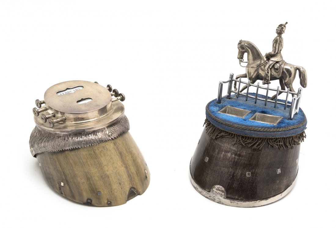 A Silverplate Mounted Hoof Encrier, Height of firs: A Silverplate Mounted Hoof Encrier, mounted with an equestrian figure, together with a hoof mounted desk calendar. Height of first overall 6 1/2 inches. Property from the Estate of Mr. Mark Fritz, Wes