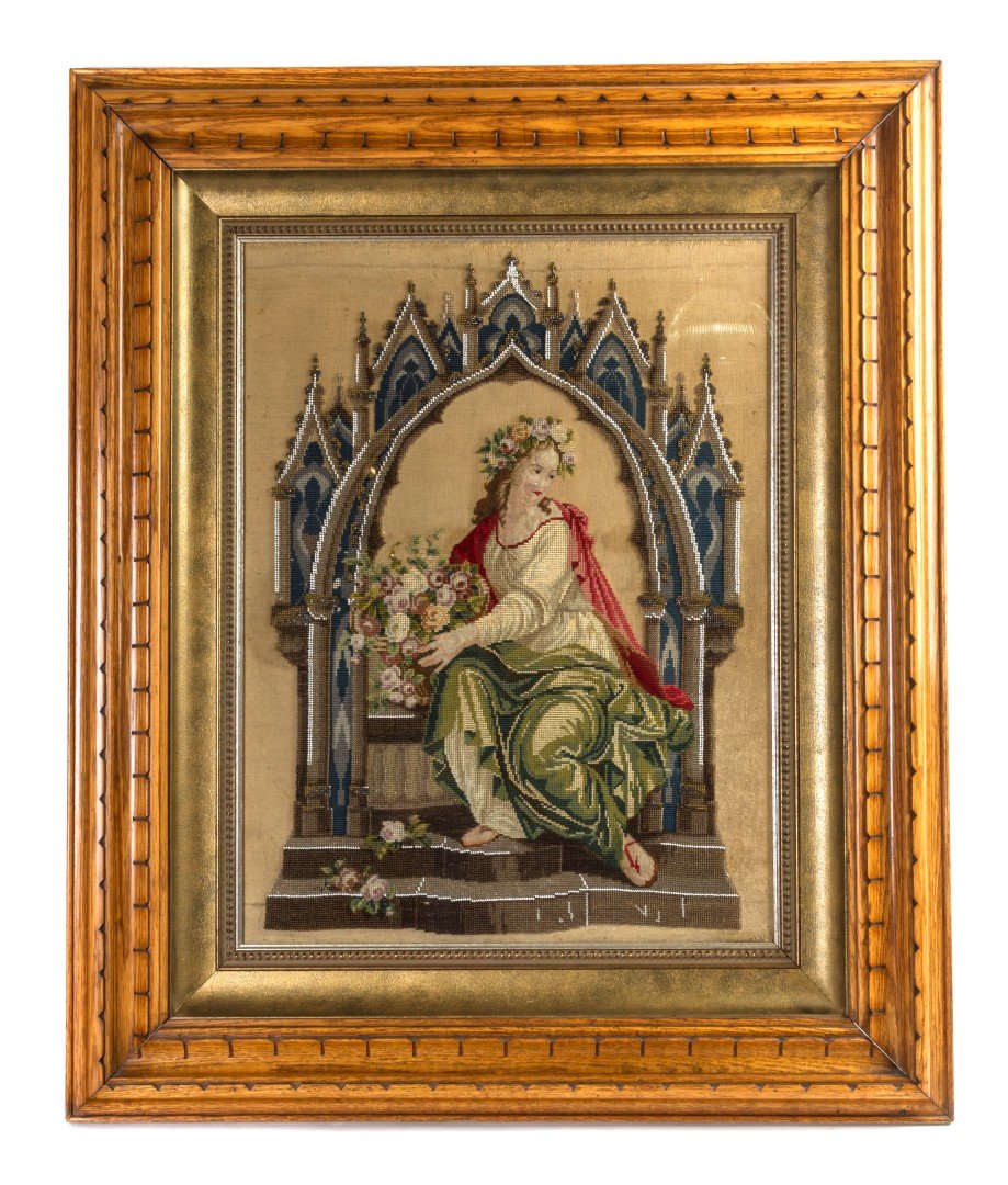 A Victorian Needlework and Beaded Pictorial Panel,: A Victorian Needlework and Beaded Pictorial Panel, depicting a robed maiden clutching a bundle of roses under a gothic arch. Height 24 x width 18 inches. Property from the Estate of Mr. Mark Fritz, We
