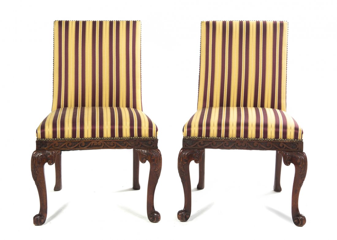 A Pair of Chippendale Style Upholstered Side Chair: A Pair of Chippendale Style Upholstered Side Chairs, 18th century and later, each with a straight crest above the upholstered back, seat and blind fret carved seat rail, raised on cabriole legs headed