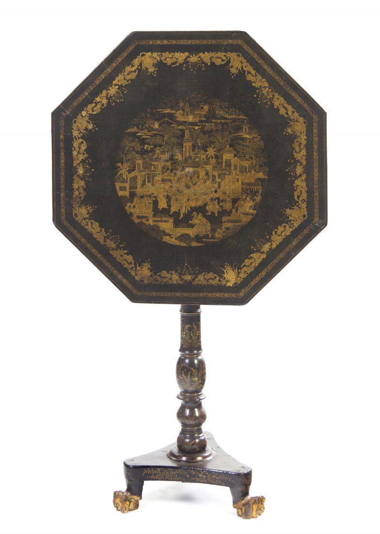 A Regency Lacquered and Parcel Gilt Tea Table, Hei: A Regency Lacquered and Parcel Gilt Tea Table, having an octagonal tilt top raised on a baluster standard over a tripartite base and hairy paw feet, with Chinoiserie decoration throughout. Height 30 x