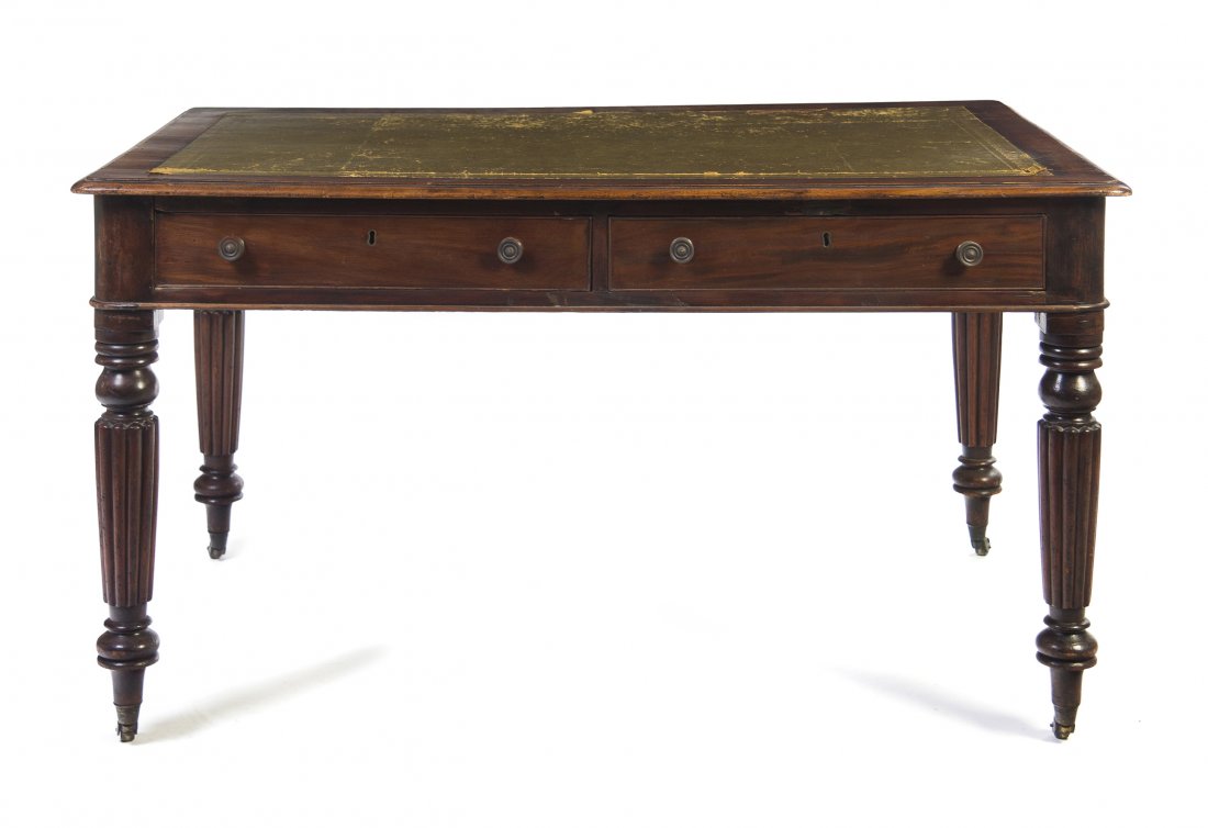 A William IV Mahogany Partner's Desk, Height 29 x : A William IV Mahogany Partner's Desk, the rectangular leather inset top with rounded corners and a molded edge, each side set with two drawers, raised on tapering reeded legs ending in casters. Height