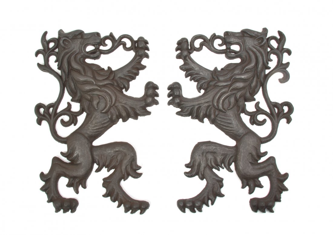 A Pair of English Cast Iron Lion Form Mounts, Heig: A Pair of English Cast Iron Lion Form Mounts, mid-19th century, depicted in opposing rampant form. Height 22 inches. Property from the Collection of Do Dillon, Chicago, Illinois