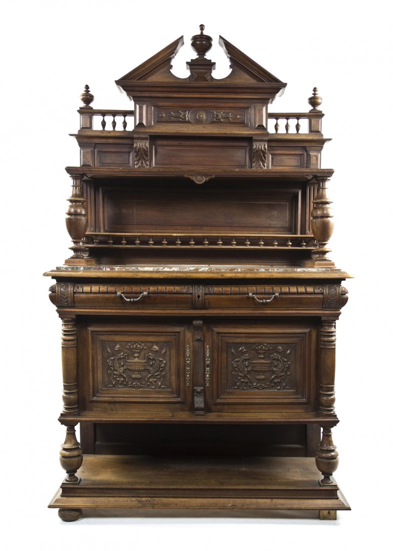 A Victorian Buffet a Deux Corps, Height 79 x width: A Victorian Buffet a Deux Corps, having a broken peaked pediment with an urn flanked by spindles, the shelf over the marble inset top and spindled plate rack, the base with two drawers over paneled do