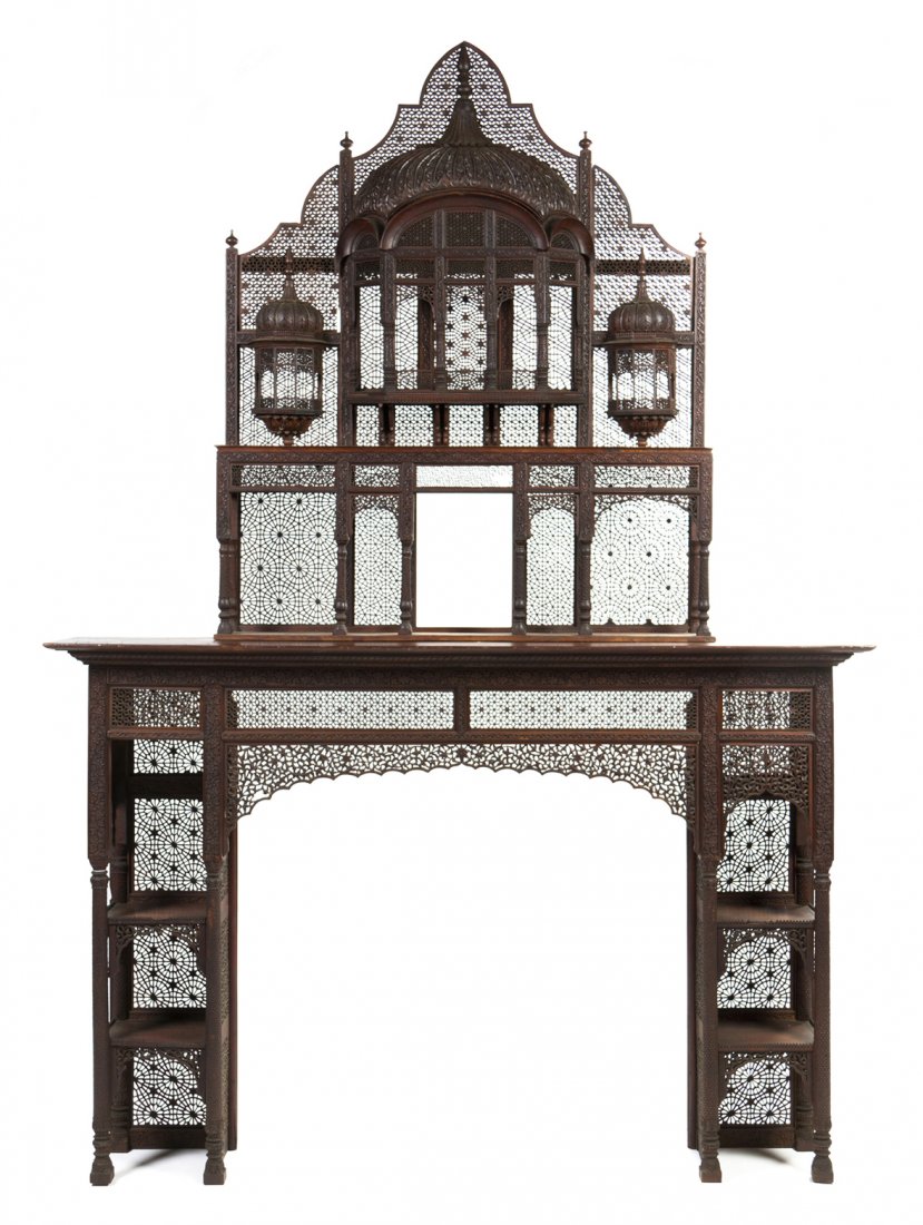 An Anglo-Indian Rosewood Fireplace Surround, in th: An Anglo-Indian Rosewood Fireplace Surround, in the manner of Lockwood de Forest, the domed and arched gallery flanked by smaller galleries above the rectangular mantel, raised on twin side supports s
