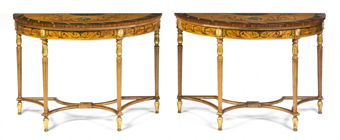 A Pair of Edwardian Style Satinwood and Parcel Gil: A Pair of Edwardian Style Satinwood and Parcel Gilt Console Tables, each having a demilune top decorated with classical scenes and scrolling leafy branches above the conforming frieze, raised on taper