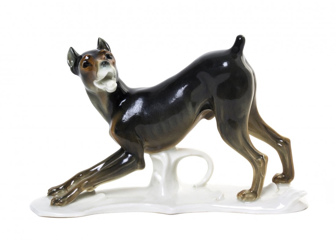 A Volkstedt Porcelain Figure, Karl Ens, Width 8 3/: A Volkstedt Porcelain Figure, Karl Ens, depicting a pouncing puppy, having standard marks, further incised 6107, with paper label. Width 8 3/4 inches. Property from the Collection of Do Dillon, Chicag