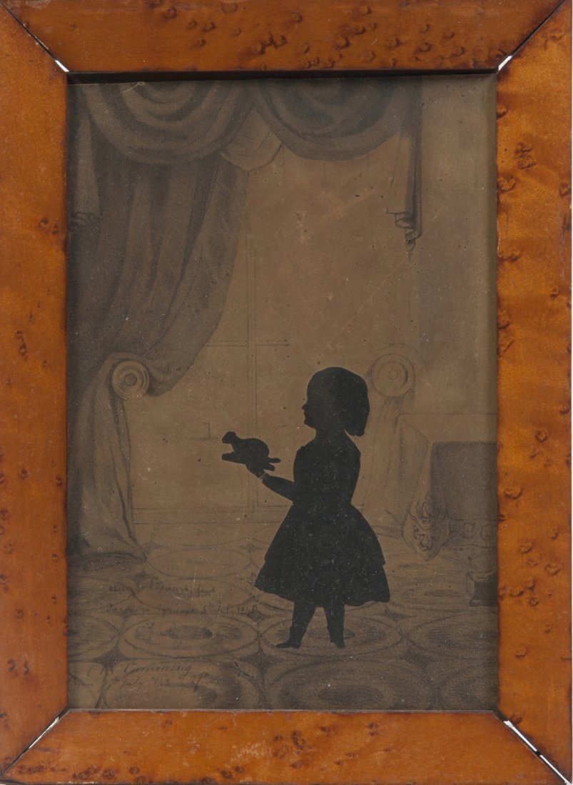 A Full Length Cut and Paste Silhouette, Augustin Edouar: A Full Length Cut and Paste Silhouette, Augustin Edouart (1789-1861), depicting a young girl holding a toy set on a lithograph interior background, signed Aug. Edouart Fecit, Saratoga Springs, 5th Jul