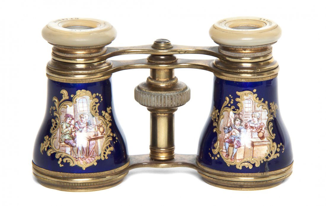 A Pair of Enameled Opera Glasses, Gibson & Co. LT: A Pair of Enameled Opera Glasses, Gibson & Co. LTD., Belfast, each decorated with courting couples in an interior against a cobalt ground. Width 4 inches. Property from the Estate of Mr. Mark Fritz, W