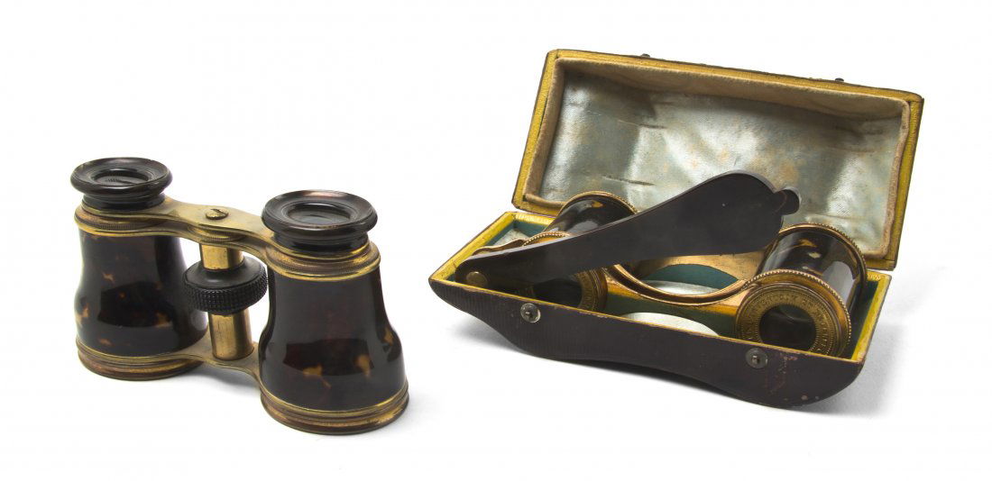 Two Pairs of French Faux Tortoise Shell Veneered: Two Pairs of French Faux Tortoise Shell Veneered Opera Glasses, the first Lunette with handle and leather carrying case, the second having oval lenses. Width of wider 4 1/4 inches. Property from the E