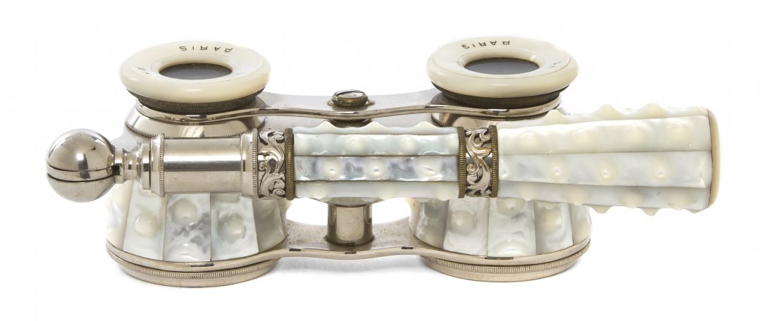 A Pair of French Mother-of-Pearl Veneered Opera G: A Pair of French Mother-of-Pearl Veneered Opera Glasses, La Corona, Paris, of typical adjustable form with handle. Width 4 inches. Property from the Estate of Mr. Mark Fritz, West Bloomfield, Michigan
