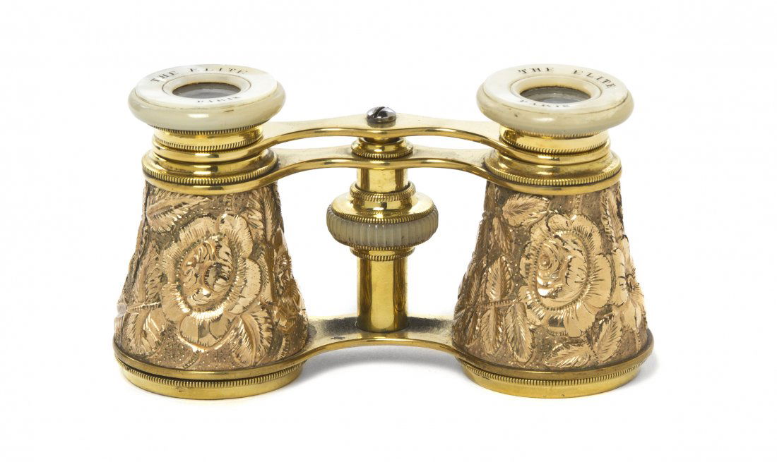 A Pair of French Gold Filled Opera Glasses, The E: A Pair of French Gold Filled Opera Glasses, The Elite, Paris, having foliate decoration and mother-of-pearl eyepieces. Width 3 7/8 inches. Property from the Estate of Mr. Mark Fritz, West Bloomfield,
