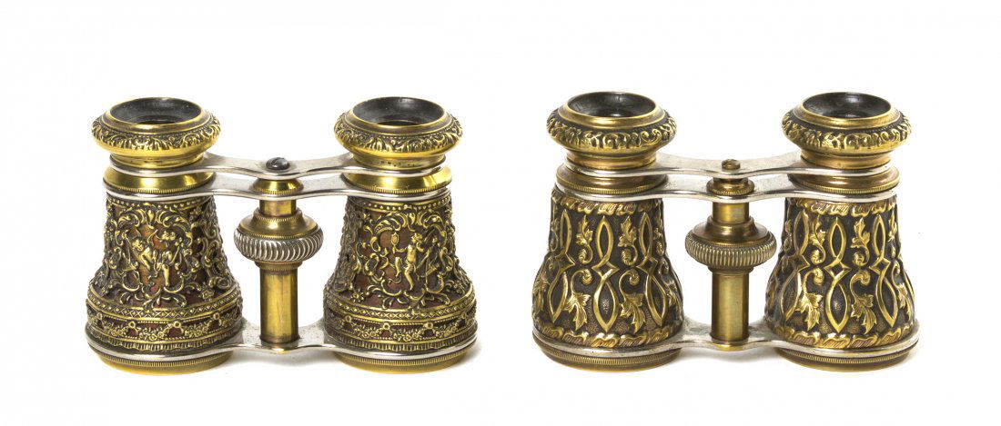 Two Pairs of Continental Opera Glasses, Width of: Two Pairs of Continental Opera Glasses, each in a brass case with relief decoration. Width of first 4 1/8 inches. Property from the Estate of Mr. Mark Fritz, West Bloomfield, Michigan