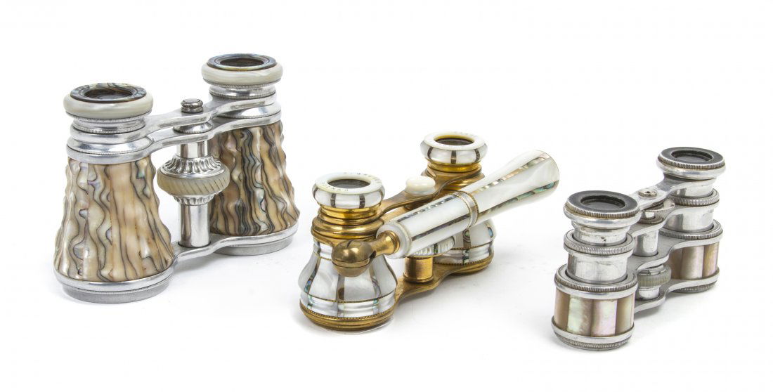 Three Pairs of Continental Mother-of-Pearl Veneer: Three Pairs of Continental Mother-of-Pearl Veneered Opera Glasses, including one example with handle by K. Greger, Poznan, one with a textured veneer by Vichy aix-les-Baines, the third example unmarke