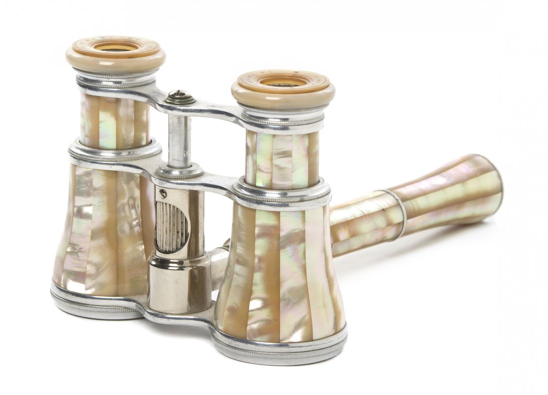 A Pair of French Mother-of-Pearl Veneered Opera G: A Pair of French Mother-of-Pearl Veneered Opera Glasses, Lemaire, with an adjuster in the handle. Width 3 7/8 inches. Property from the Estate of Mr. Mark Fritz, West Bloomfield, Michigan