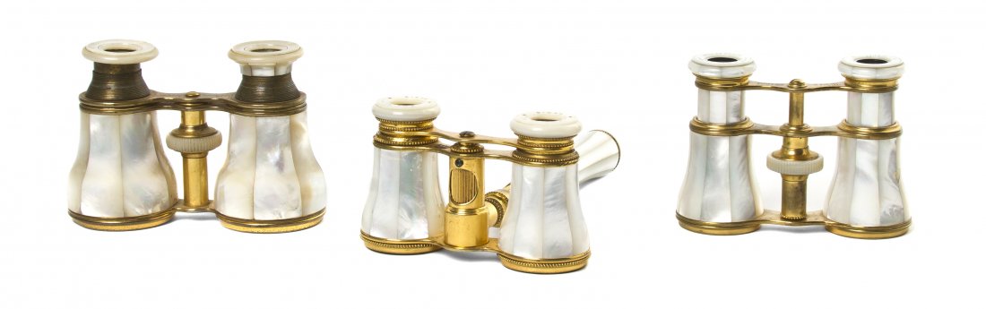 Three Pairs of French Mother-of-Pearl Opera Glass: Three Pairs of French Mother-of-Pearl Opera Glasses, comprising two by Lemaire, one fitted with a central conforming handle having a focus wheel and one unmarked example, each with a brass frame. Widt