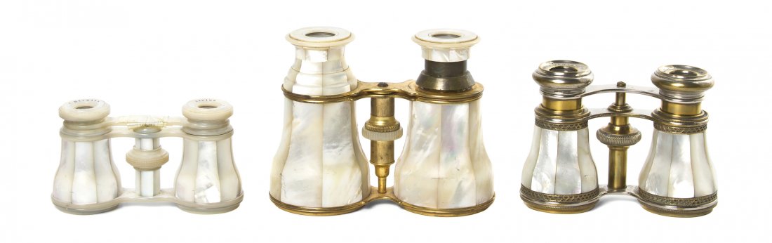 Three French Mother-of-Pearl Veneered Opera Glass: Three French Mother-of-Pearl Veneered Opera Glasses, comprising one with a brass frame, one with a mother-of-pearl frame and one with a steel frame. Width of widest 4 3/4 inches. Property from the Est