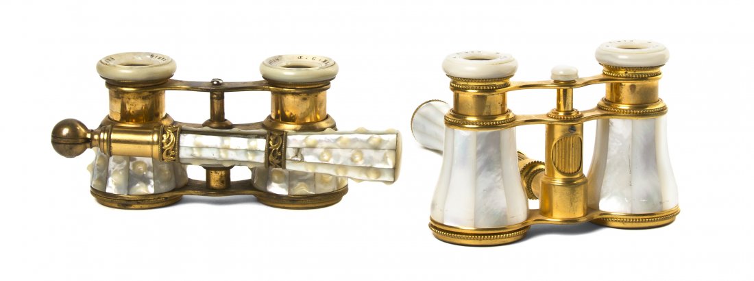 Two Pairs of French Mother-of-Pearl Veneered Oper: Two Pairs of French Mother-of-Pearl Veneered Opera Glasses, comprising a Lemaire example having a central conforming handle with a focus wheel and a textured example with a side swing handle. Width 3 