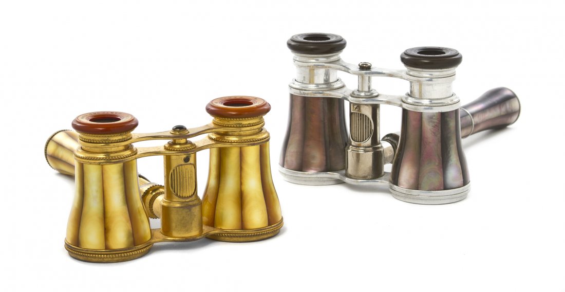 Two Pairs of French Mother-of-Pearl Veneered Oper: Two Pairs of French Mother-of-Pearl Veneered Opera Glasses, Lemaire, each with a conforming central handle having a focus wheel, one with a brass frame, the other aluminum. Width 3 7/8 inches. Propert