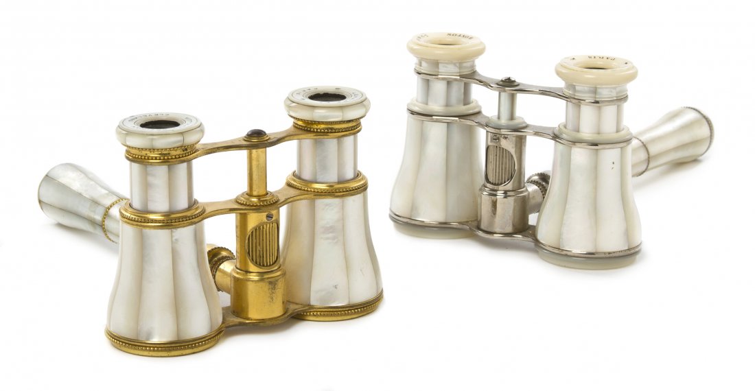 Two Pairs of French Mother-of-Pearl Veneered Oper: Two Pairs of French Mother-of-Pearl Veneered Opera Glasses, Lemaire, one with a brass frame, the other steel, each having a central conforming handle with a focus wheel. Width 3 7/8 inches. Property f