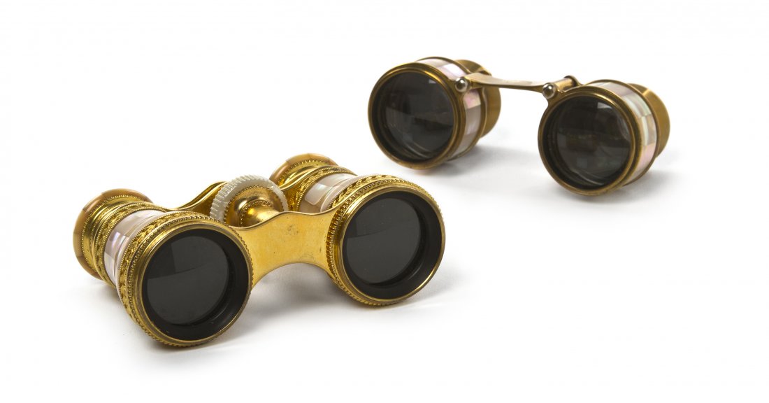Two Pairs of French Mother-of-Pearl Veneered Oper: Two Pairs of French Mother-of-Pearl Veneered Opera Glasses, the first Lemaire retailed by the Smith-Patterson Company, Boston, the second Precioptic Levallois, each with gilt metal frames. Width of fi