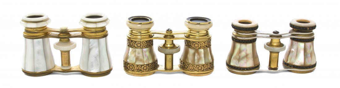 Three Pairs of Mother-of-Pearl Veneered Opera Gla: Three Pairs of Mother-of-Pearl Veneered Opera Glasses, each having faceted veneers, the first with stylized cast foliate banding, signed indistinctly. Width of widest 3 7/8 inches. Property from the E