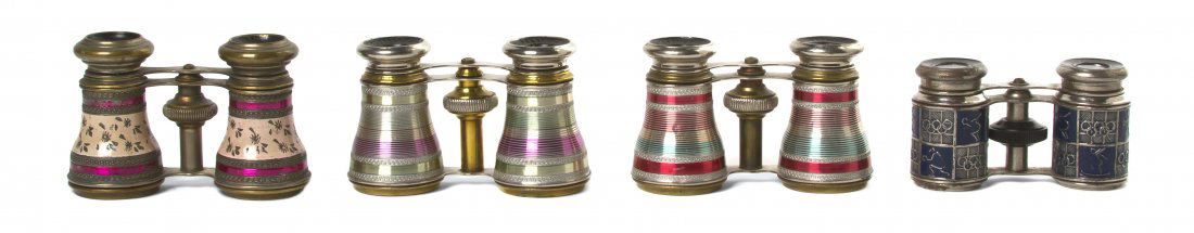Four Pairs of French Opera Glasses, Width of wide: Four Pairs of French Opera Glasses, comprising two examples with concentric linear decoration, one with Olympic decoration, the last with foliate decoration. Width of widest 4 1/8 inches. Property fro