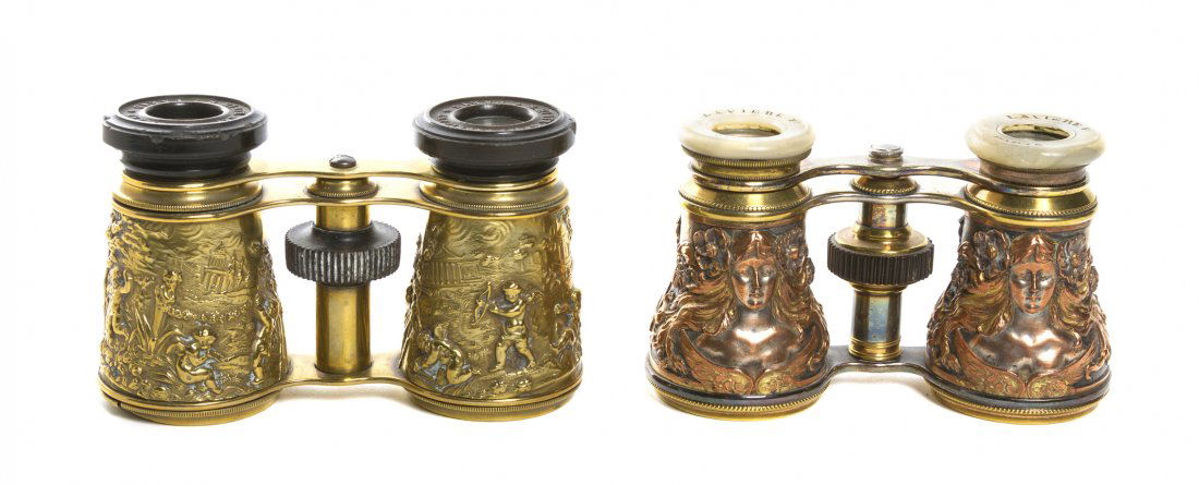 Two Pairs of French Metal Opera Glasses, Width of: Two Pairs of French Metal Opera Glasses, the first copper by Laviere with scrolling decoration, the second brass by S. Hirtz decorated with figures. Width of first 4 1/4 inches. Property from the Esta