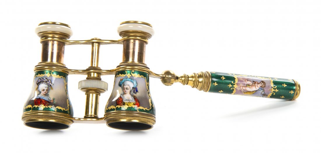 A Pair of Continental Enameled Opera Glasses, Wid: A Pair of Continental Enameled Opera Glasses, each cylinder decorated with a portrait of a woman, having a handle decorated with a putto playing a musical instrument. Width 3 7/8 inches. Property from