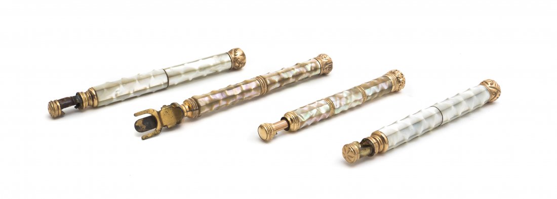 Four Mother-of-Pearl Veneered Opera Glass Holders: Four Mother-of-Pearl Veneered Opera Glass Holders, each with a textured finish, each having various repousse decoration to pommel. Length of longest 6 3/8 inches (closed). Property from the Estate of